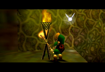 Link using a Deku Stick to light one of the unlit torches