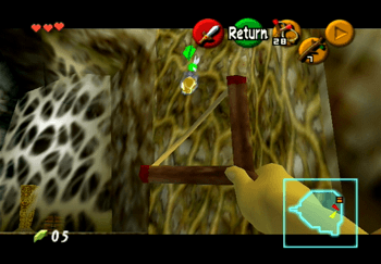 Using the Fairy Slingshot to destroy the Gold Skulltula on the vines