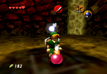 Link dropping a bomb on the floor in the middle of the last room.